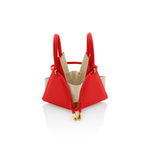 Buy now the Iconic LIA Mini bag inspired by the geometric shapes of our designer's birth city Barcelona, and its world known artist, Antonio Gaudí, architect of the world wonder La Sagrada Familia. The Iconic Lia Red Mini bag has a unique and functional pyramidal design able to fit all your essentials.