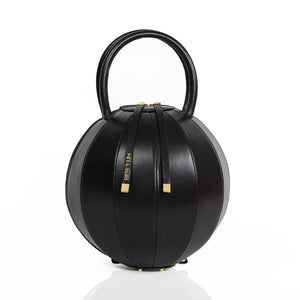 Buy now the Iconic Pilo Handbag inspired by the geometric shapes of our designer's birth city Barcelona, and its world known artist, Antonio Gaudí, architect of the world wonder La Sagrada Familia. The Iconic Pilo Black Handbag has a unique and functional pyramidal design able to fit all your essentials. 
