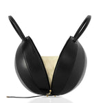 Buy now the Iconic Pilo Handbag inspired by the geometric shapes of our designer's birth city Barcelona, and its world known artist, Antonio Gaudí, architect of the world wonder La Sagrada Familia. The Iconic Pilo Black Handbag has a unique and functional pyramidal design able to fit all your essentials.