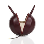 Buy now the Iconic Pilo Handbag inspired by the geometric shapes of our designer's birth city Barcelona, and its world known artist, Antonio Gaudí, architect of the world wonder La Sagrada Familia. The Iconic Pilo Burgundy Handbag has a unique and functional pyramidal design able to fit all your essentials.