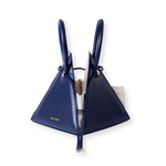 Buy now the Iconic Lia Handbag inspired by the geometric shapes of our designer's birth city Barcelona, and its world known artist, Antonio Gaudí, architect of the world wonder La Sagrada Familia. The Iconic Lia Ocean Blue Handbag has a unique and functional pyramidal design able to fit all your essentials.