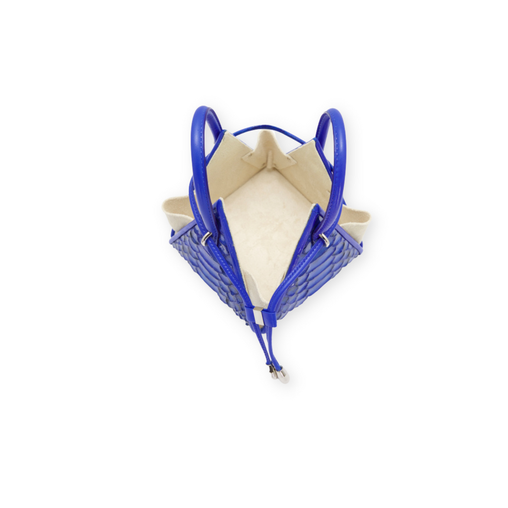Buy now the Exotic LIA Mini bag inspired by the geometric shapes of our designer's birth city Barcelona, and its world known artist, Antonio Gaudí, architect of the world wonder La Sagrada Familia. The Exotic Lia Electric Blue Mini bag has a unique and functional pyramidal design able to fit all your essentials.