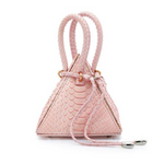 Buy now the Exotic Lia Handbag inspired by the geometric shapes of our designer's birth city Barcelona, and its world known artist, Antonio Gaudí, architect of the world wonder La Sagrada Familia. The Iconic Lia Python Pastel Pink Handbag has a unique and functional pyramidal design able to fit all your essentials.