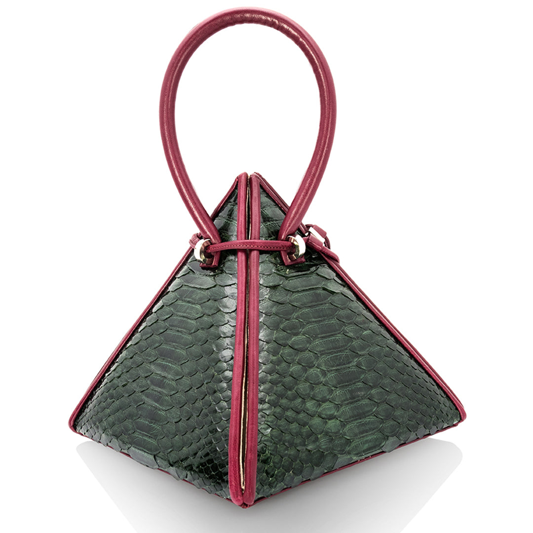 Buy now the Exotic Lia Handbag inspired by the geometric shapes of our designer's birth city Barcelona, and its world known artist, Antonio Gaudí, architect of the world wonder La Sagrada Familia. The Iconic Lia Green & Burgundy Handbag has a unique and functional pyramidal design able to fit all your essentials. 