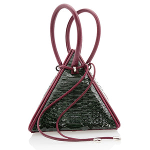 Buy now the Exotic Lia Handbag inspired by the geometric shapes of our designer's birth city Barcelona, and its world known artist, Antonio Gaudí, architect of the world wonder La Sagrada Familia. The Iconic Lia Green & Burgundy Handbag has a unique and functional pyramidal design able to fit all your essentials. 