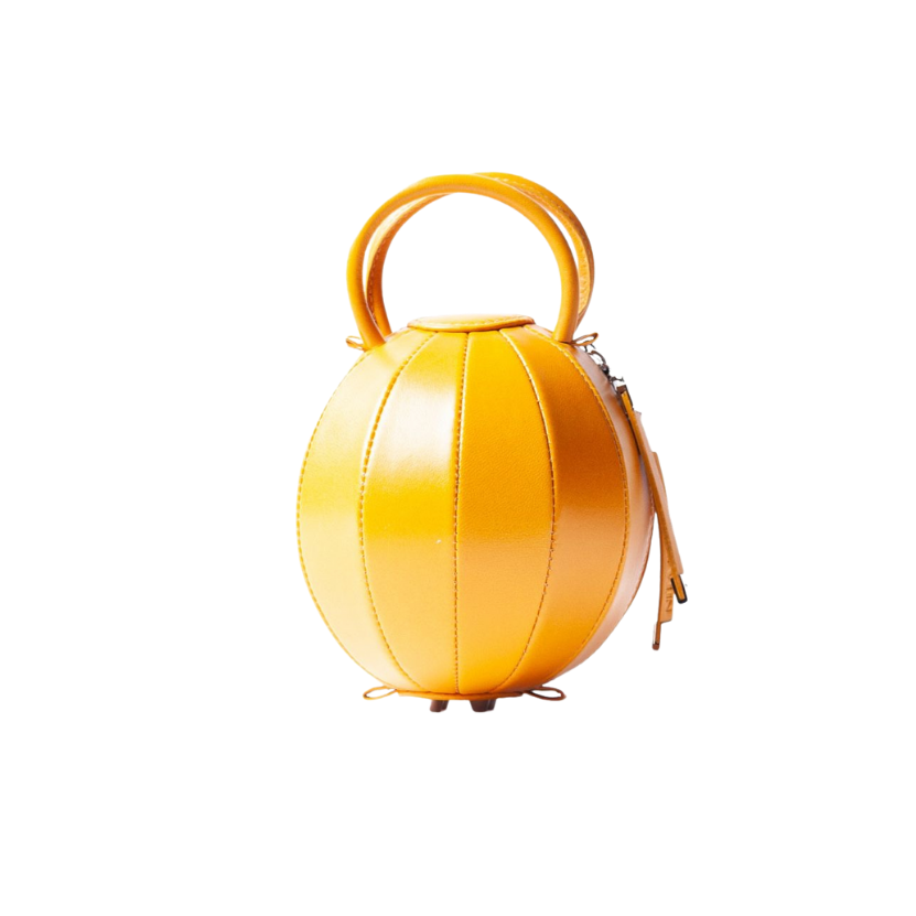 Buy now the iconic Pilo Minibag inspired by the geometric shapes of our designer's birth city Barcelona, and its world known artist, Antonio Gaudí, architect of the world wonder La Sagrada Familia. The iconic Pilo Amber Minibag has a unique and functional sphere design able to fit all your essentials. 