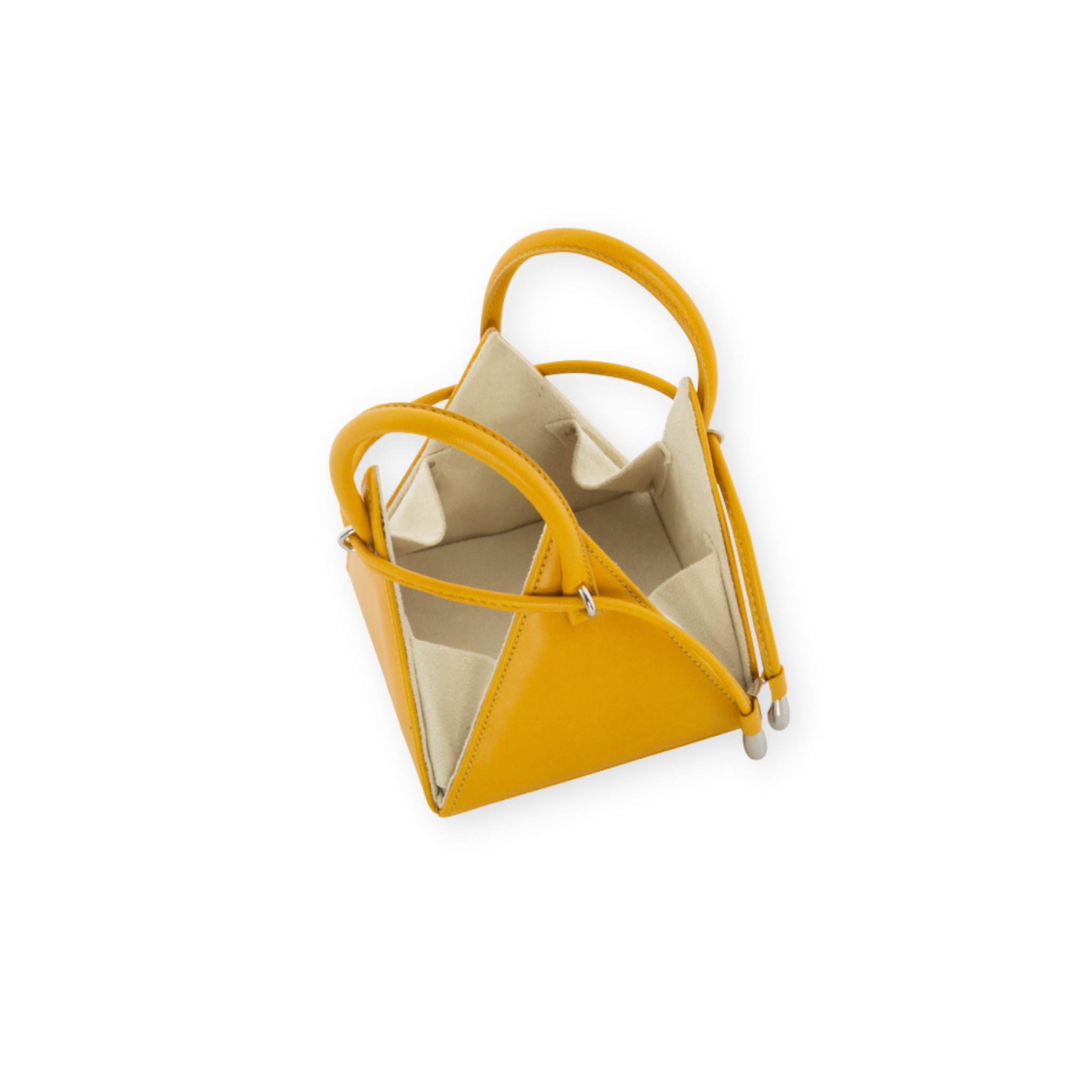 Buy now the Iconic Lia Handbag inspired by the geometric shapes of our designer's birth city Barcelona, and its world known artist, Antonio Gaudí, architect of the world wonder La Sagrada Familia. The Iconic Lia Amber Mini bag has a unique and functional pyramidal design able to fit all your essentials. 