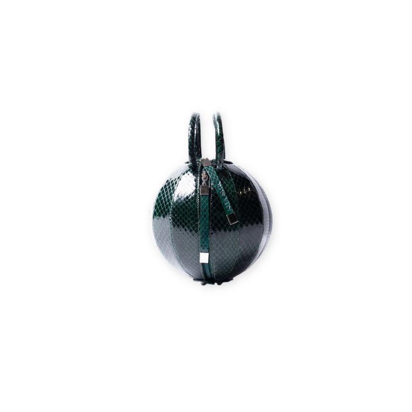 Buy now the exotic Pilo Minibag inspired by the geometric shapes of our designer's birth city Barcelona, and its world known artist, Antonio Gaudí, architect of the world wonder La Sagrada Familia. The iconic Pilo emerald Minibag has a unique and functional sphere design able to fit all your essentials. 