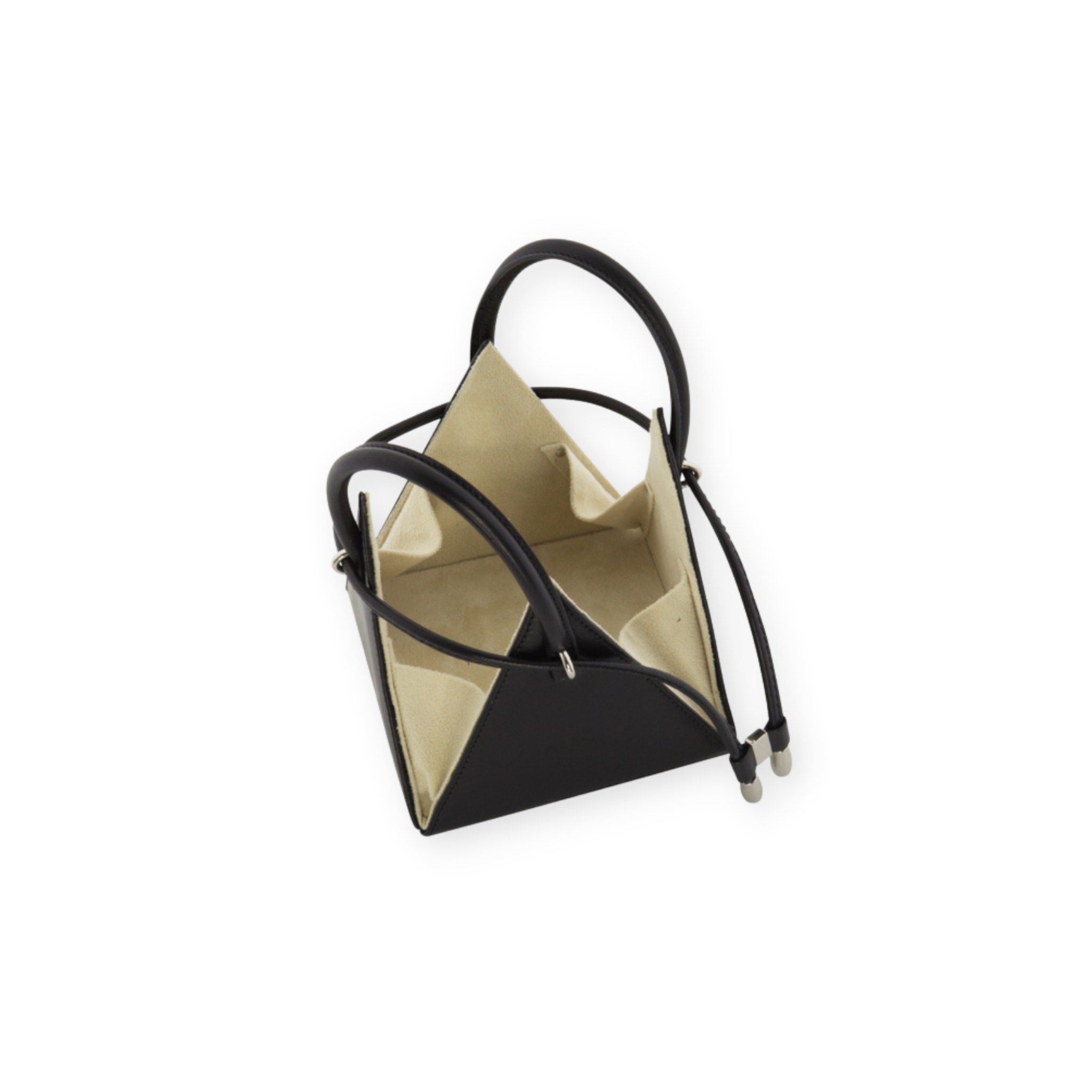 Buy now the Iconic LIA Mini Bag inspired by the geometric shapes of our designer's birth city Barcelona, and its world known artist, Antonio Gaudí, architect of the world wonder La Sagrada Familia. The Iconic Lia Black Mini Bag has a unique and functional pyramidal design able to fit all your essentials. 