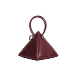 Buy now the Iconic LIA Mini bag inspired by the geometric shapes of our designer's birth city Barcelona, and its world known artist, Antonio Gaudí, architect of the world wonder La Sagrada Familia. The Iconic Lia Burgundy Mini bag has a unique and functional pyramidal design able to fit all your essentials. 