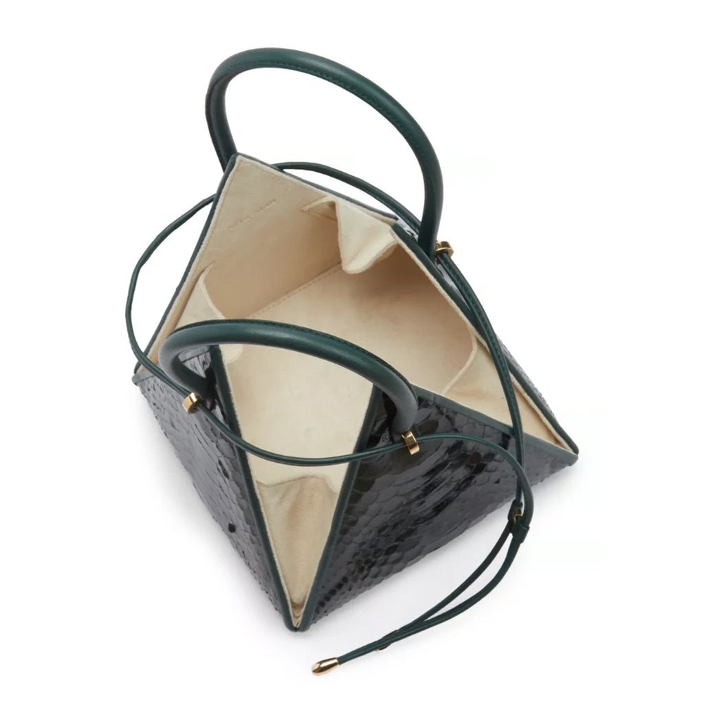 Buy now the Exotic Lia Handbag inspired by the geometric shapes of our designer's birth city Barcelona, and its world known artist, Antonio Gaudí, architect of the world wonder La Sagrada Familia. The Exotic Lia Emerald Green Handbag has a unique and functional pyramidal design able to fit all your essentials. 