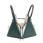Buy now the Iconic Lia Handbag inspired by the geometric shapes of our designer's birth city Barcelona, and its world known artist, Antonio Gaudí, architect of the world wonder La Sagrada Familia. The Iconic Lia Cipresso Green Handbag has a unique and functional pyramidal design able to fit all your essentials. 