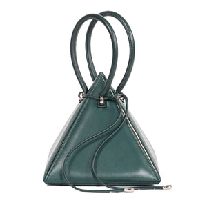 Buy now the Iconic Lia Handbag inspired by the geometric shapes of our designer's birth city Barcelona, and its world known artist, Antonio Gaudí, architect of the world wonder La Sagrada Familia. The Iconic Lia Cipresso Green Handbag has a unique and functional pyramidal design able to fit all your essentials. 