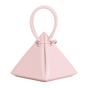 Buy now the Iconic Lia Handbag inspired by the geometric shapes of our designer's birth city Barcelona, and its world known artist, Antonio Gaudí, architect of the world wonder La Sagrada Familia. The Iconic Lia Pink Handbag has a unique and functional pyramidal design able to fit all your essentials. 