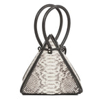 Buy now the Exotic Lia Handbag inspired by the geometric shapes of our designer's birth city Barcelona, and its world known artist, Antonio Gaudí, architect of the world wonder La Sagrada Familia. The Iconic Lia Python Natural Handbag has a unique and functional pyramidal design able to fit all your essentials. 