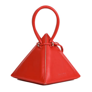 Buy now the Iconic Lia Handbag inspired by the geometric shapes of our designer's birth city Barcelona, and its world known artist, Antonio Gaudí, architect of the world wonder La Sagrada Familia. The Iconic Lia Red Handbag has a unique and functional pyramidal design able to fit all your essentials.