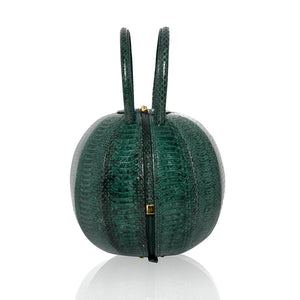 Buy now the Exotic Pilo Handbag inspired by the geometric shapes of our designer's birth city Barcelona, and its world known artist, Antonio Gaudí, architect of the world wonder La Sagrada Familia. The Exotic Pilo Cipresso Handbag has a unique and functional sphere design able to fit all your essentials. 