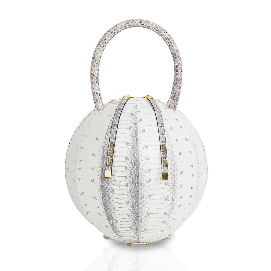 Buy now the Exotic Pilo Handbag inspired by the geometric shapes of our designer's birth city Barcelona, and its world known artist, Antonio Gaudí, architect of the world wonder La Sagrada Familia. The Exotic Pilo Natural Handbag has a unique and functional sphere design able to fit all your essentials. 