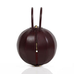 Buy now the Iconic Pilo Handbag inspired by the geometric shapes of our designer's birth city Barcelona, and its world known artist, Antonio Gaudí, architect of the world wonder La Sagrada Familia. The Iconic Pilo Burgundy Handbag has a unique and functional pyramidal design able to fit all your essentials. 