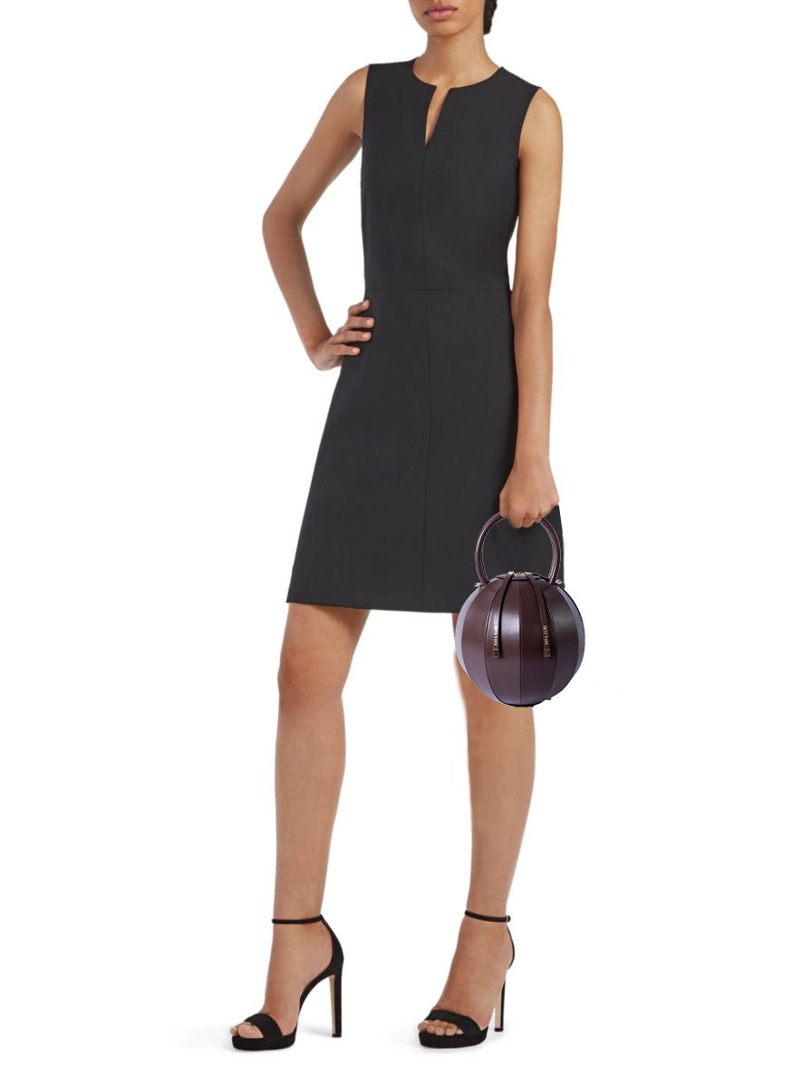 Buy now the Iconic Pilo Handbag inspired by the geometric shapes of our designer's birth city Barcelona, and its world known artist, Antonio Gaudí, architect of the world wonder La Sagrada Familia. The Iconic Pilo Chocolate Brown Handbag has a unique and functional pyramidal design able to fit all your essentials. 