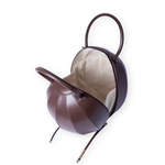 Buy now the Iconic Pilo Handbag inspired by the geometric shapes of our designer's birth city Barcelona, and its world known artist, Antonio Gaudí, architect of the world wonder La Sagrada Familia. The Iconic Pilo Chocolate Brown Handbag has a unique and functional pyramidal design able to fit all your essentials. 