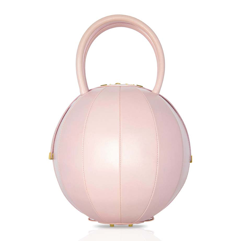 Buy now the Iconic Pilo Handbag inspired by the geometric shapes of our designer's birth city Barcelona, and its world known artist, Antonio Gaudí, architect of the world wonder La Sagrada Familia. The Iconic Pilo Pink Handbag has a unique and functional pyramidal design able to fit all your essentials. 