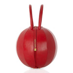 Buy now the Iconic Pilo Handbag inspired by the geometric shapes of our designer's birth city Barcelona, and its world known artist, Antonio Gaudí, architect of the world wonder La Sagrada Familia. The Iconic Pilo Red Handbag has a unique and functional sphere design able to fit all your essentials. 