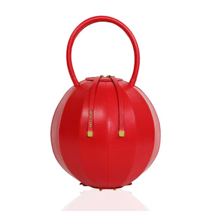 Buy now the Iconic Pilo Handbag inspired by the geometric shapes of our designer's birth city Barcelona, and its world known artist, Antonio Gaudí, architect of the world wonder La Sagrada Familia. The Iconic Pilo Red Handbag has a unique and functional sphere design able to fit all your essentials. 