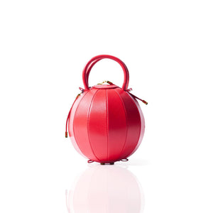 Buy now the iconic Pilo Minibag inspired by the geometric shapes of our designer's birth city Barcelona, and its world known artist, Antonio Gaudí, architect of the world wonder La Sagrada Familia. The iconic Pilo Red Minibag has a unique and functional sphere design able to fit all your essentials. 