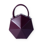 Buy now the Iconic Diamond Handbag inspired by the geometric shapes of our designer's birth city Barcelona, and its world known artist, Antonio Gaudí, architect of the world wonder La Sagrada Familia. The Iconic Diamond Burgundy Handbag has a unique and functional diamond design able to fit all your essentials. 