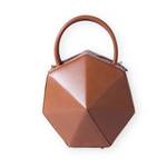 Buy now the Iconic Diamond Handbag inspired by the geometric shapes of our designer's birth city Barcelona, and its world known artist, Antonio Gaudí, architect of the world wonder La Sagrada Familia. The Iconic Diamond Cuero Tan Handbag has a unique and functional diamond design able to fit all your essentials. 
