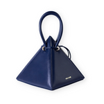 Buy now the Iconic Lia Handbag inspired by the geometric shapes of our designer's birth city Barcelona, and its world known artist, Antonio Gaudí, architect of the world wonder La Sagrada Familia. The Iconic Lia Ocean Blue Handbag has a unique and functional pyramidal design able to fit all your essentials. 