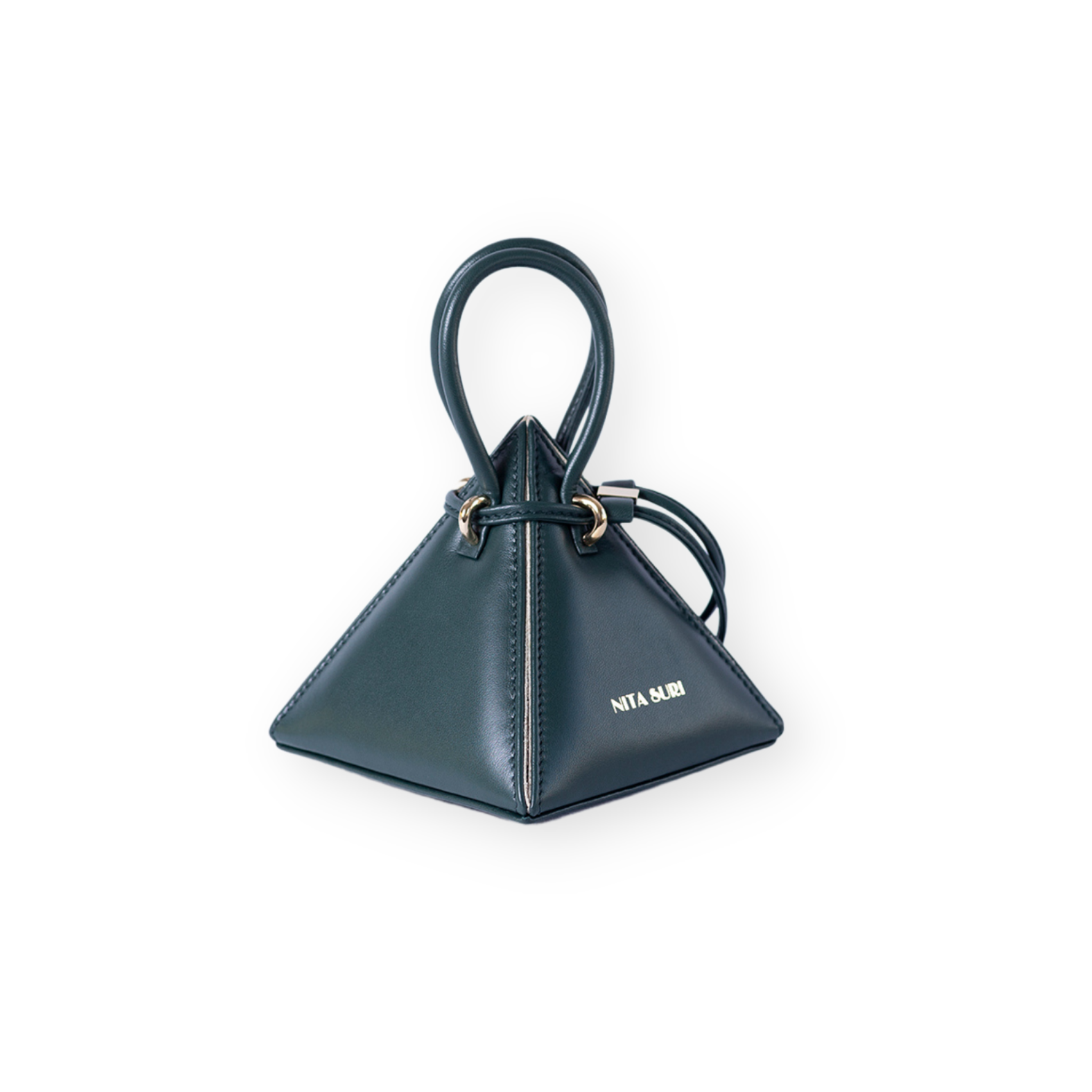 Buy now the Iconic LIA Mini bag inspired by the geometric shapes of our designer's birth city Barcelona, and its world known artist, Antonio Gaudí, architect of the world wonder La Sagrada Familia. The Iconic Lia Forest Green Mini bag has a unique and functional pyramidal design able to fit all your essentials. 