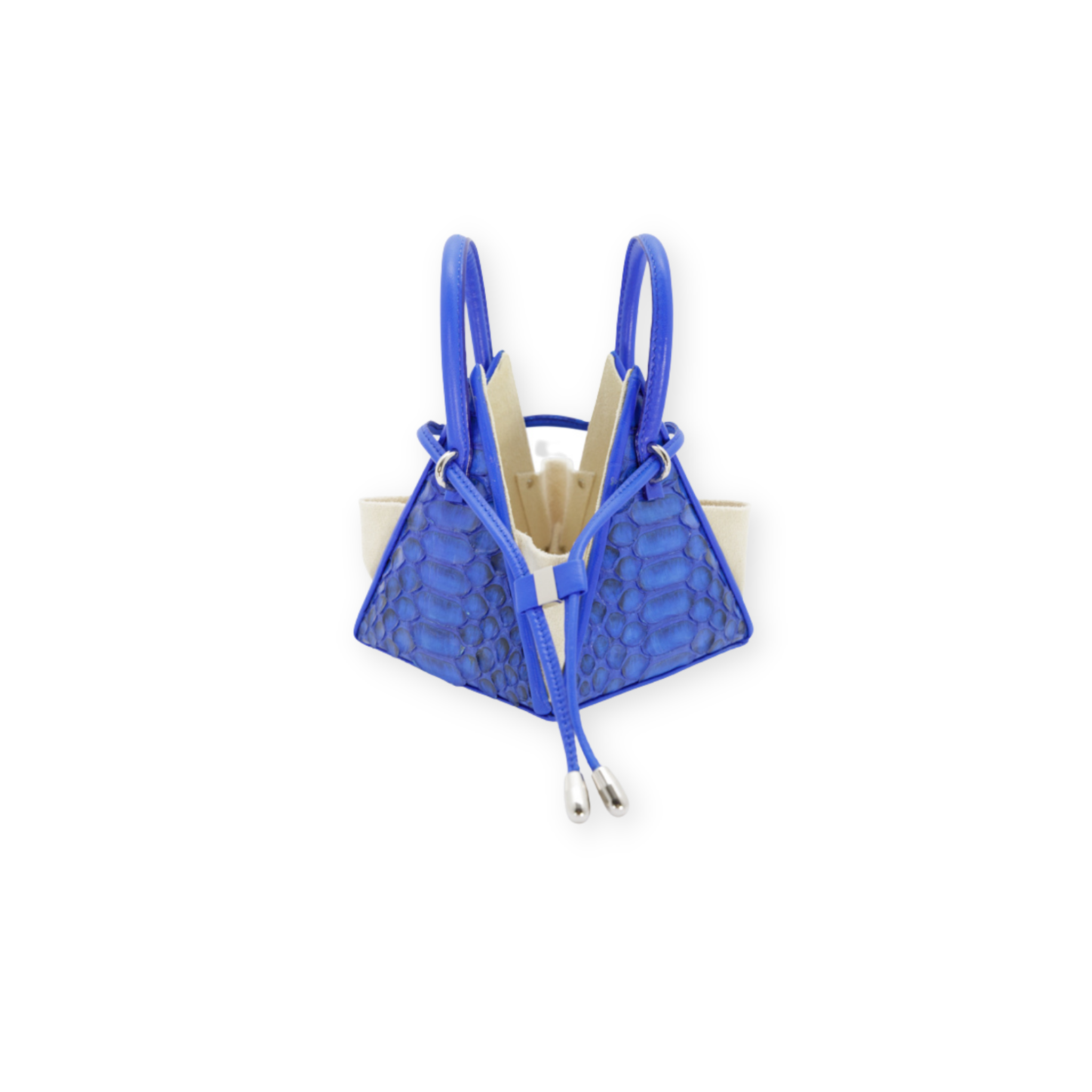 Buy now the Exotic LIA Mini bag inspired by the geometric shapes of our designer's birth city Barcelona, and its world known artist, Antonio Gaudí, architect of the world wonder La Sagrada Familia. The Exotic Lia Electric Blue Mini bag has a unique and functional pyramidal design able to fit all your essentials. 