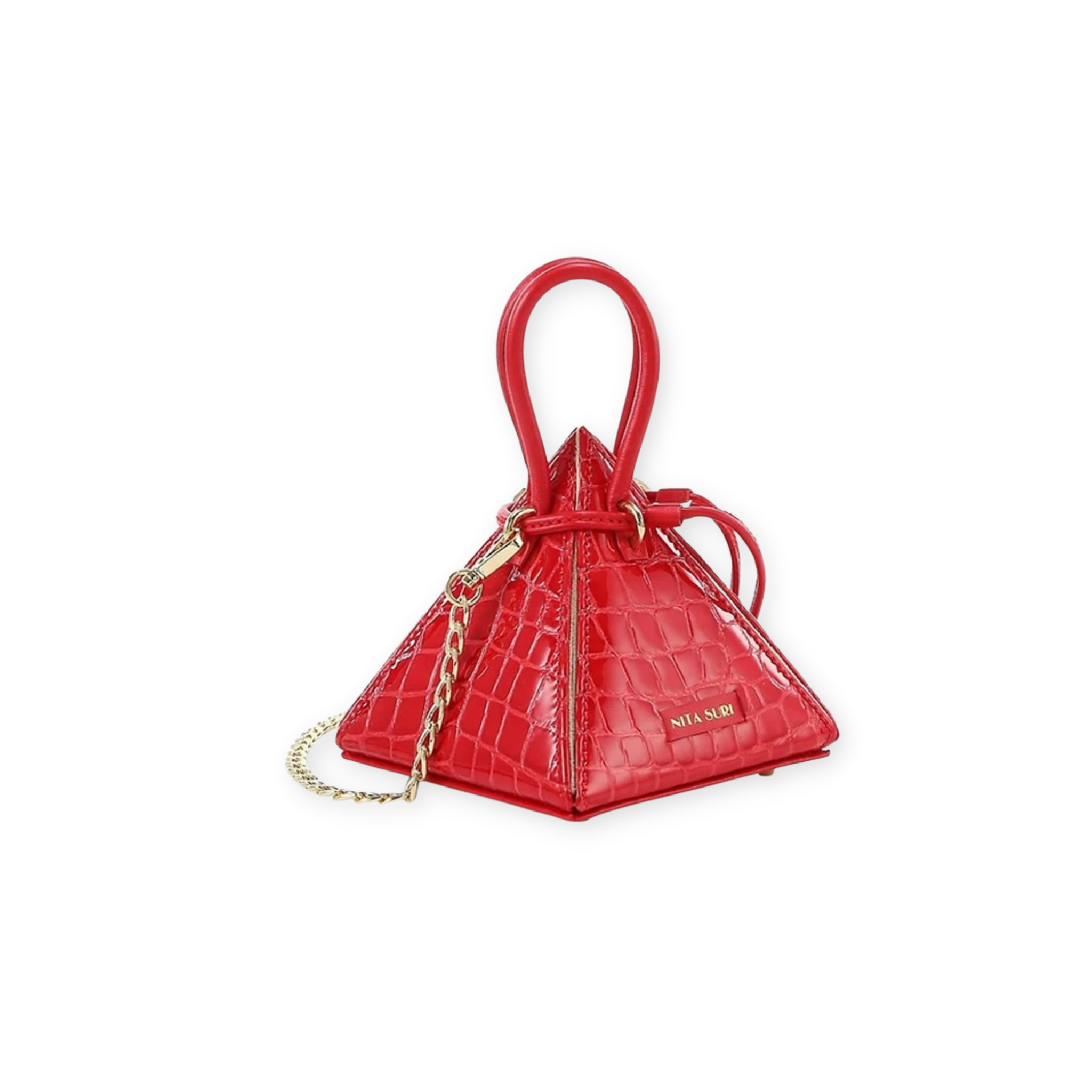 Buy now the Exotic LIA Mini bag inspired by the geometric shapes of our designer's birth city Barcelona, and its world known artist, Antonio Gaudí, architect of the world wonder La Sagrada Familia. The Exotic Lia Croc-Embossed Passion Red Mini bag has a unique and functional pyramidal design able to fit all your essentials. 