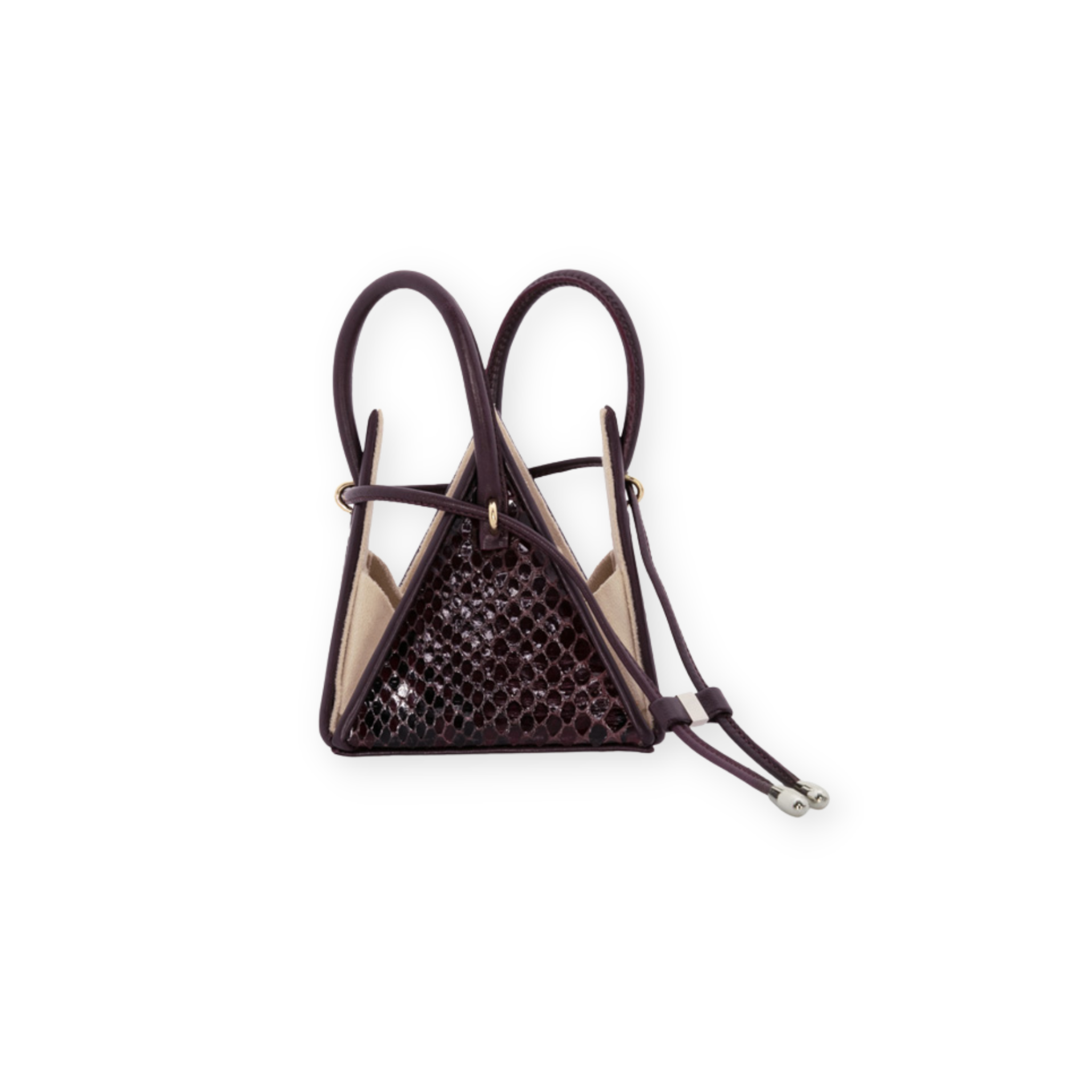 Buy now the Exotic LIA Mini bag inspired by the geometric shapes of our designer's birth city Barcelona, and its world known artist, Antonio Gaudí, architect of the world wonder La Sagrada Familia. The Exotic Lia Python Burgundy Mini bag has a unique and functional pyramidal design able to fit all your essentials. 