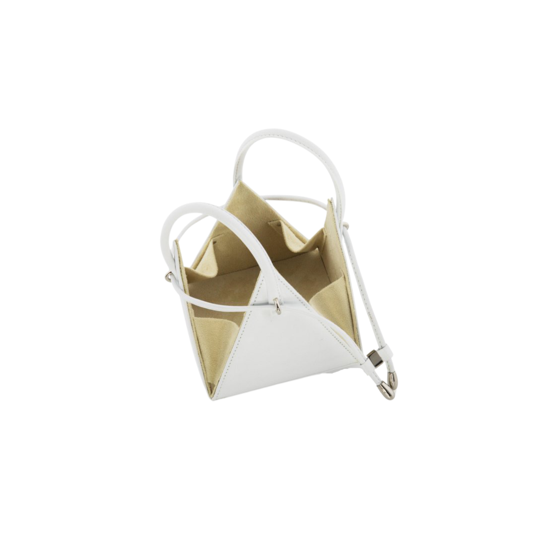 Buy now the Iconic LIA Mini bag inspired by the geometric shapes of our designer's birth city Barcelona, and its world known artist, Antonio Gaudí, architect of the world wonder La Sagrada Familia. The Iconic Lia White Mini bag has a unique and functional pyramidal design able to fit all your essentials. 