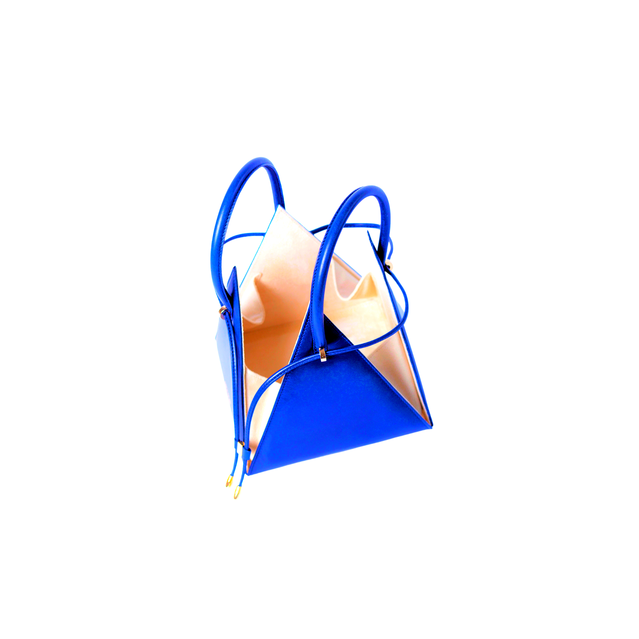 Buy now the Iconic LIA Mini bag inspired by the geometric shapes of our designer's birth city Barcelona, and its world known artist, Antonio Gaudí, architect of the world wonder La Sagrada Familia. The Iconic Lia Electric Blue Mini bag has a unique and functional pyramidal design able to fit all your essentials. 