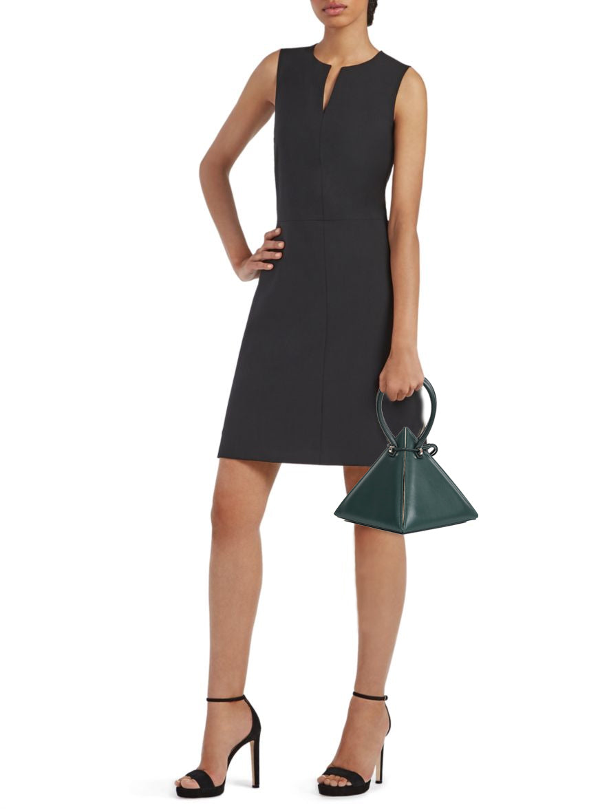 Buy now the Iconic Lia Handbag inspired by the geometric shapes of our designer's birth city Barcelona, and its world known artist, Antonio Gaudí, architect of the world wonder La Sagrada Familia. The Iconic Lia Cipresso Green Handbag has a unique and functional pyramidal design able to fit all your essentials. 